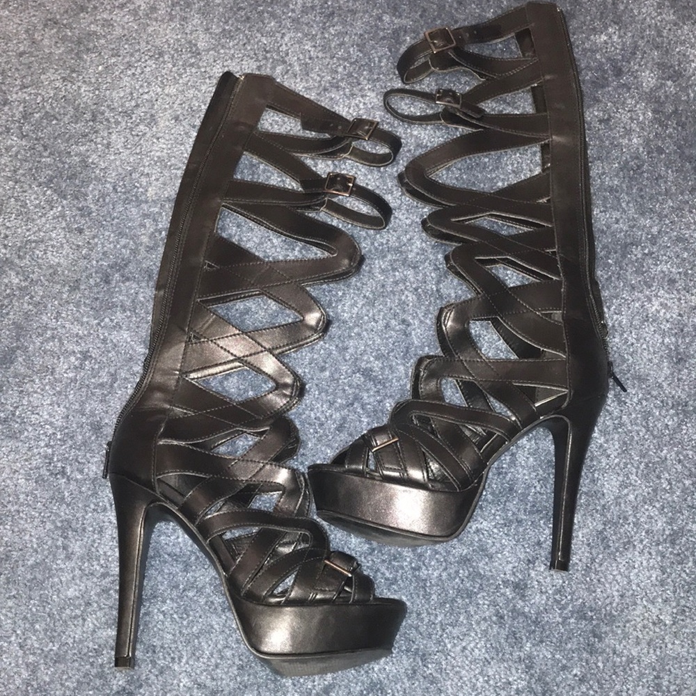 “Call it Spring” black synthetic heel boots.